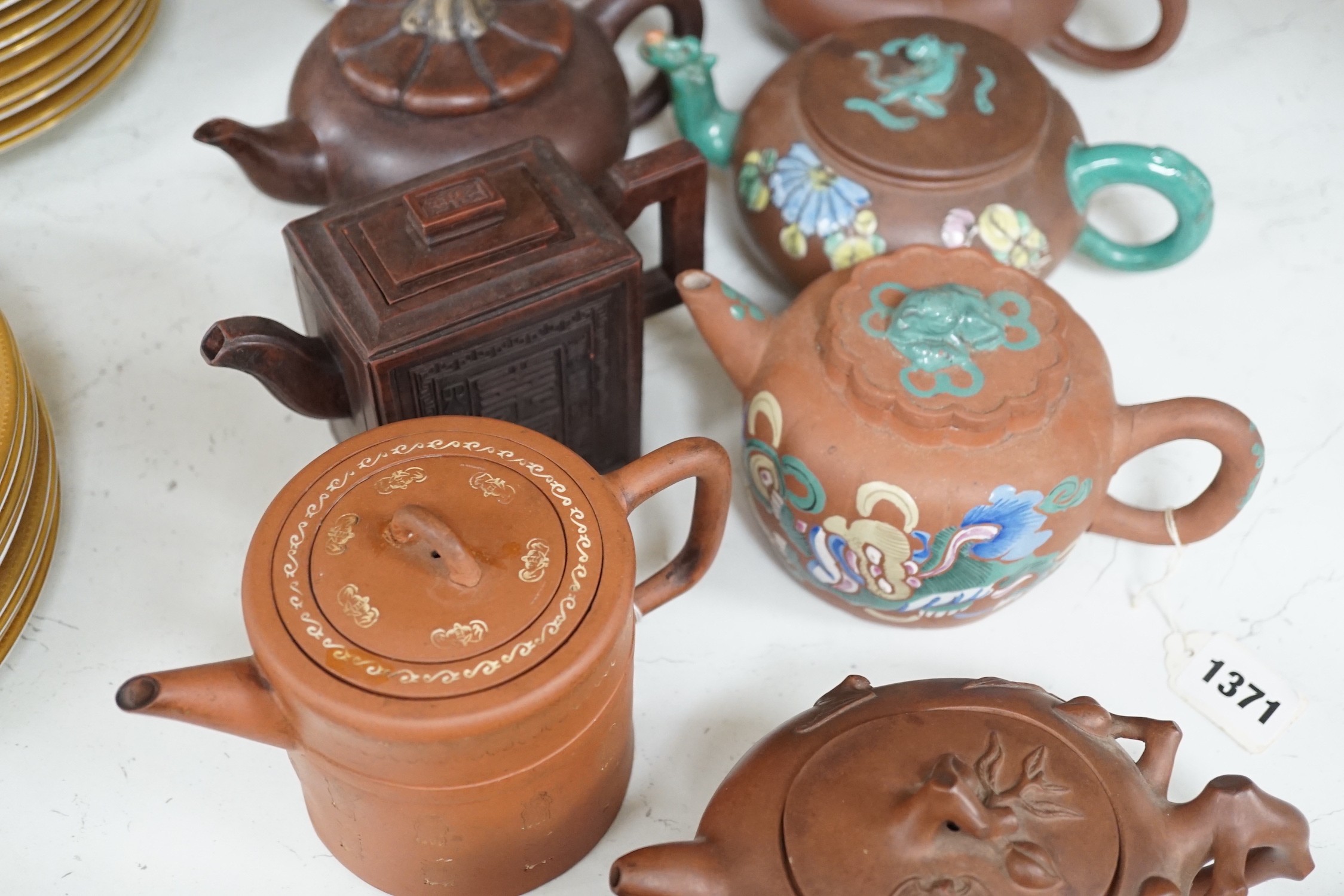 A quantity of Chinese Yixing teapots, a cinnabar resin jar and cover, a Samson teapot etc.